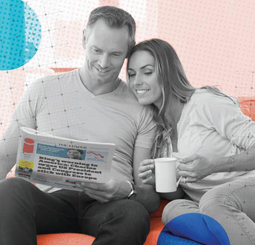 Couple reading The i Paper